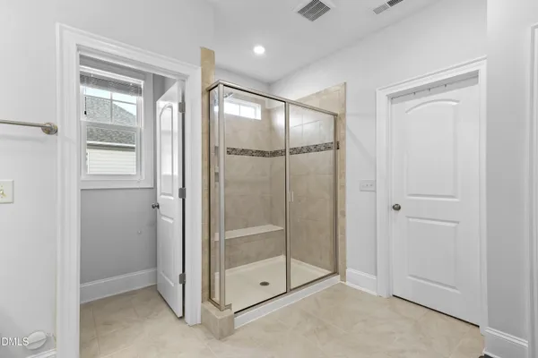 a bedroom with a bed and a table