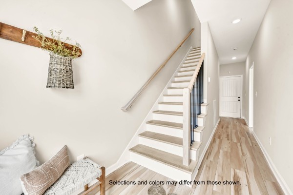 2373 Pea Ridge Road Clarksville, TN 37040 - Photo 5 of 18 a view of a bedroom with wooden floor and stairs