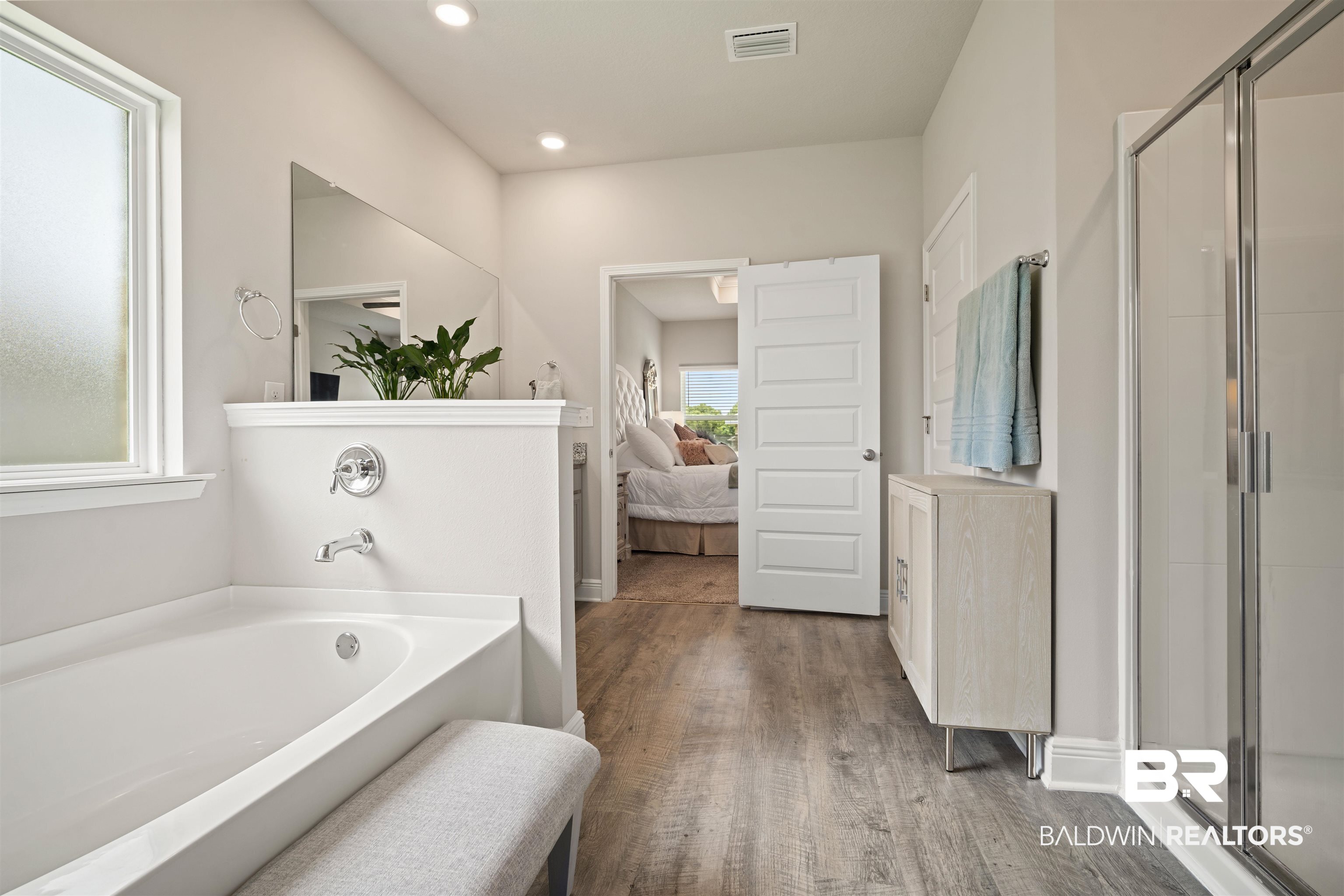 10474 Loamy Avenue Mobile, AL 36695 - Photo 15 of 31 Ensuite bathroom featuring a bath, a shower stall, wood finished floors, recessed lighting, and vanity