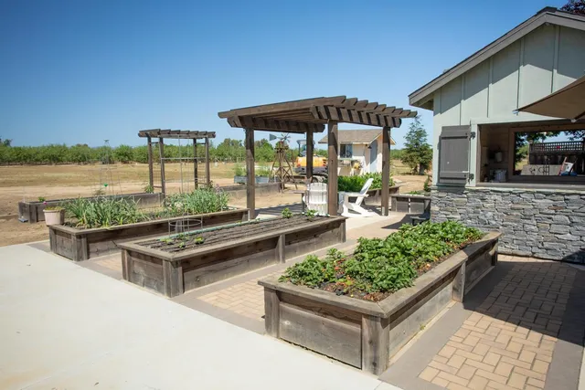 a view of a porch with furniture and wooden floor