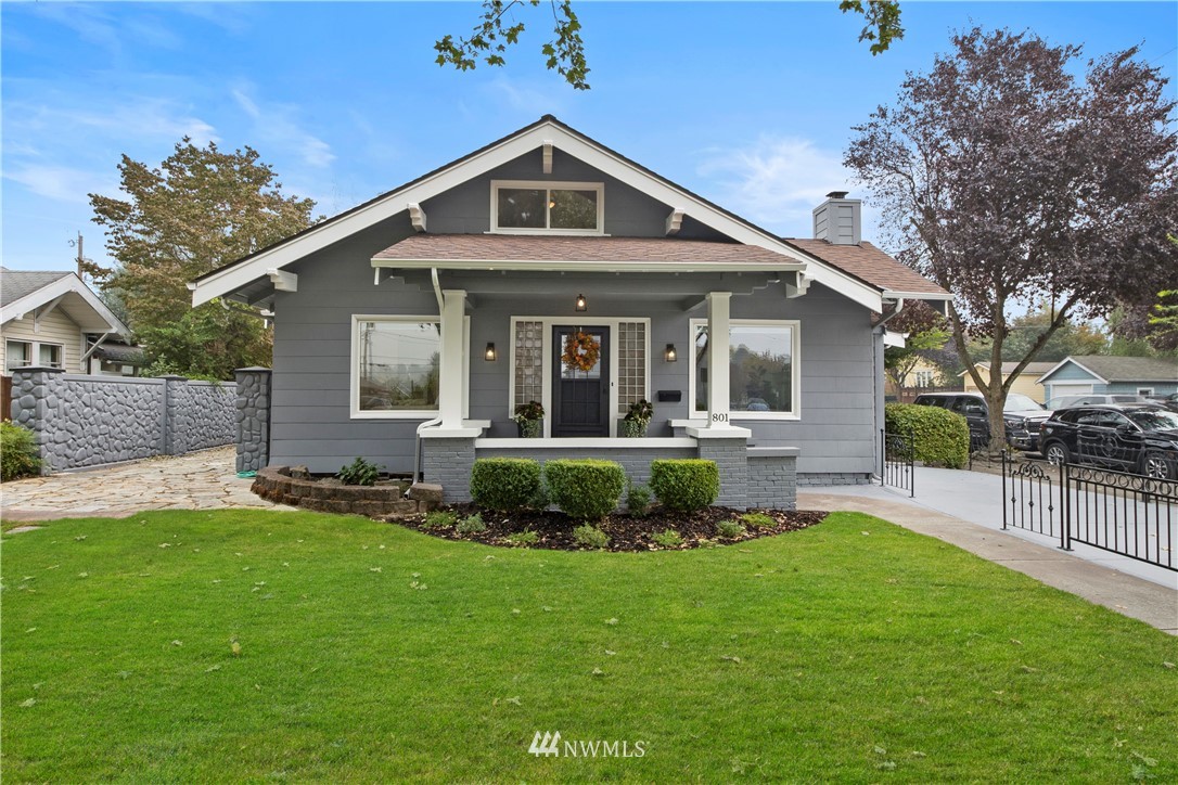 801 Ryan Avenue Sumner, WA 98390 - Photo 1 of 35 a front view of a house with a yard