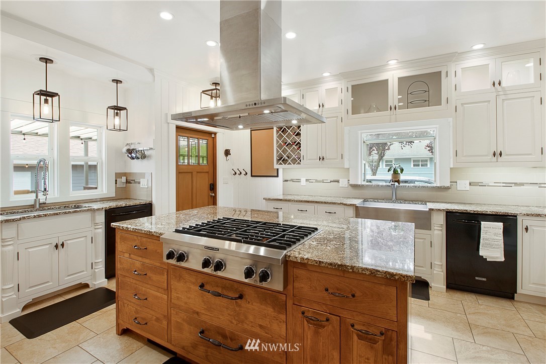 801 Ryan Avenue Sumner, WA 98390 - Photo 16 of 35 a kitchen with granite countertop a sink stove and cabinets