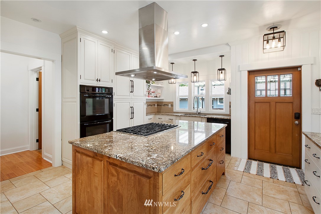 801 Ryan Avenue Sumner, WA 98390 - Photo 18 of 35 a kitchen with stainless steel appliances granite countertop a stove and a refrigerator