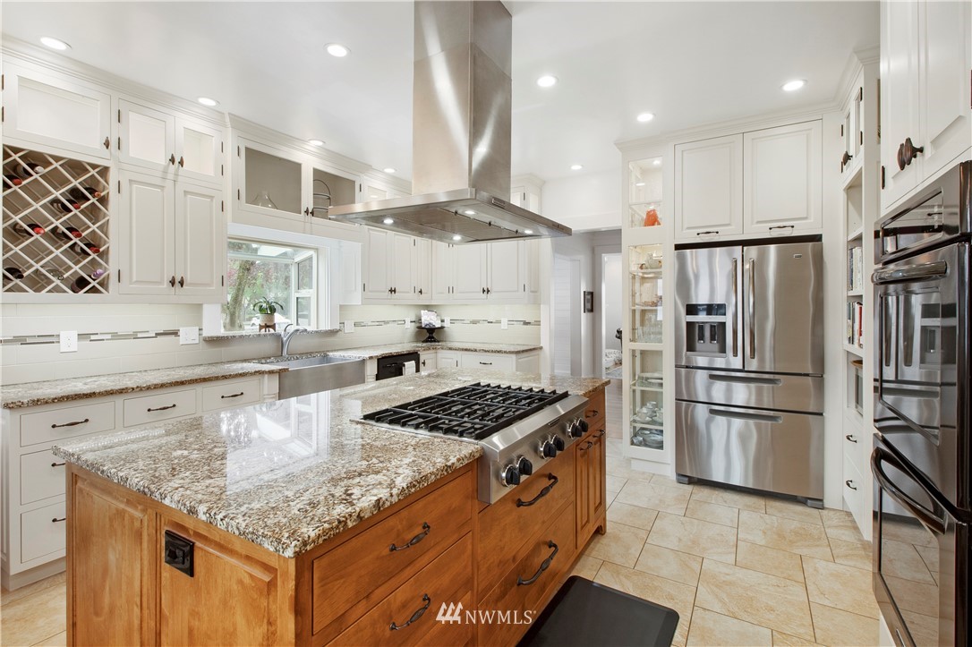 801 Ryan Avenue Sumner, WA 98390 - Photo 19 of 35 a kitchen with stainless steel appliances granite countertop a sink stove and refrigerator