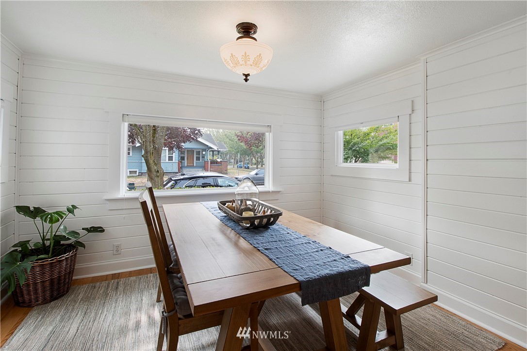 801 Ryan Avenue Sumner, WA 98390 - Photo 23 of 35 a view of a dining room with furniture window and wooden floor