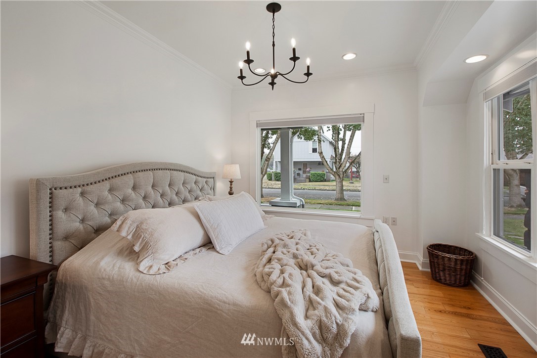 801 Ryan Avenue Sumner, WA 98390 - Photo 24 of 35 a bedroom with a large bed and a window