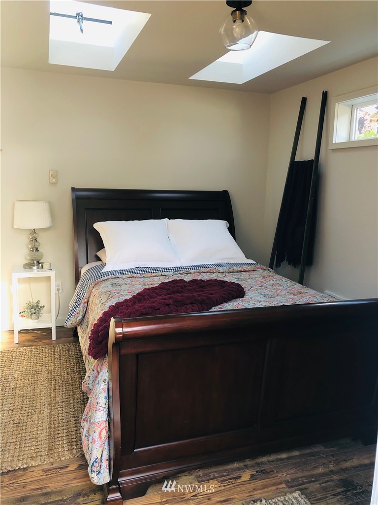 801 Ryan Avenue Sumner, WA 98390 - Photo 34 of 35 a bed sitting in a bedroom next to a window