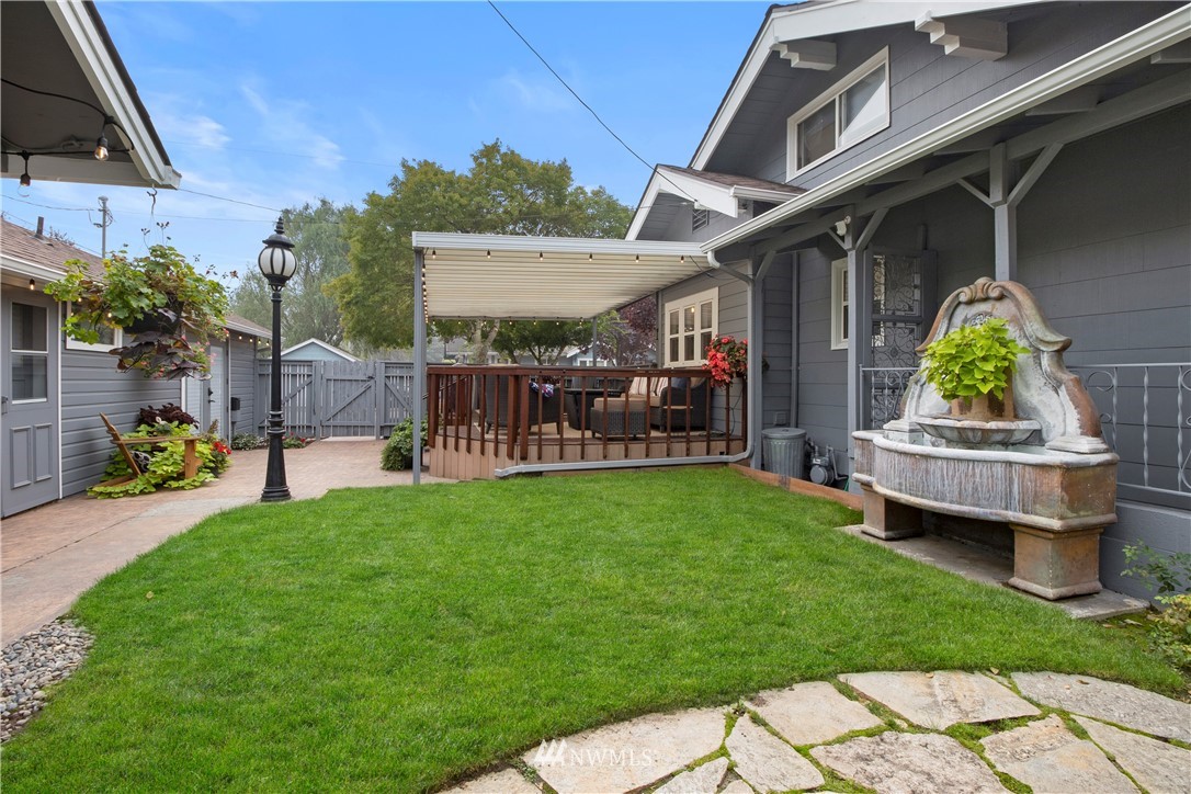 801 Ryan Avenue Sumner, WA 98390 - Photo 7 of 35 a view of a house with a backyard