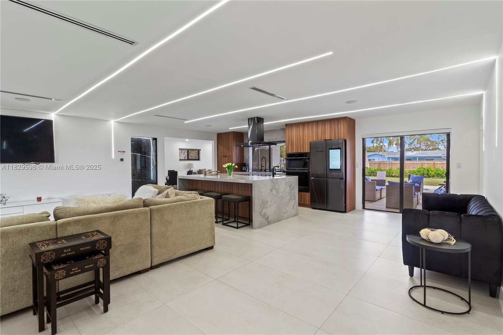 5131 Monroe Street Hollywood, FL 33021 - Photo 13 of 52 a living room with furniture and kitchen view