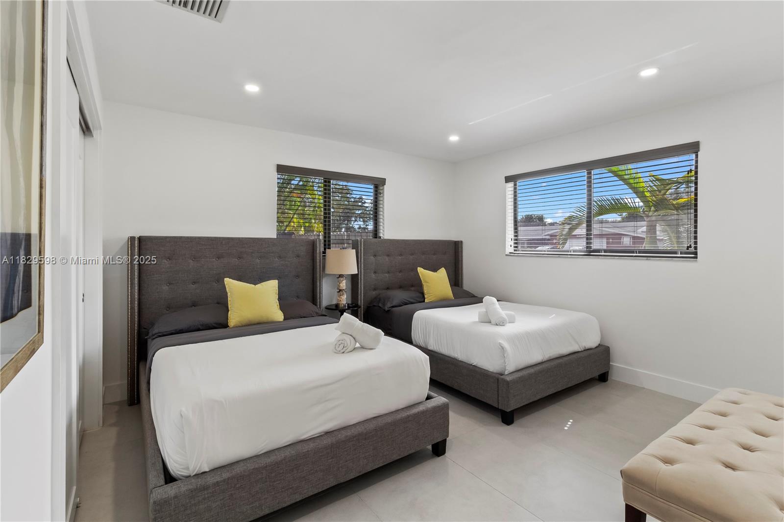 5131 Monroe Street Hollywood, FL 33021 - Photo 26 of 52 a bedroom with two beds and painting on the wall