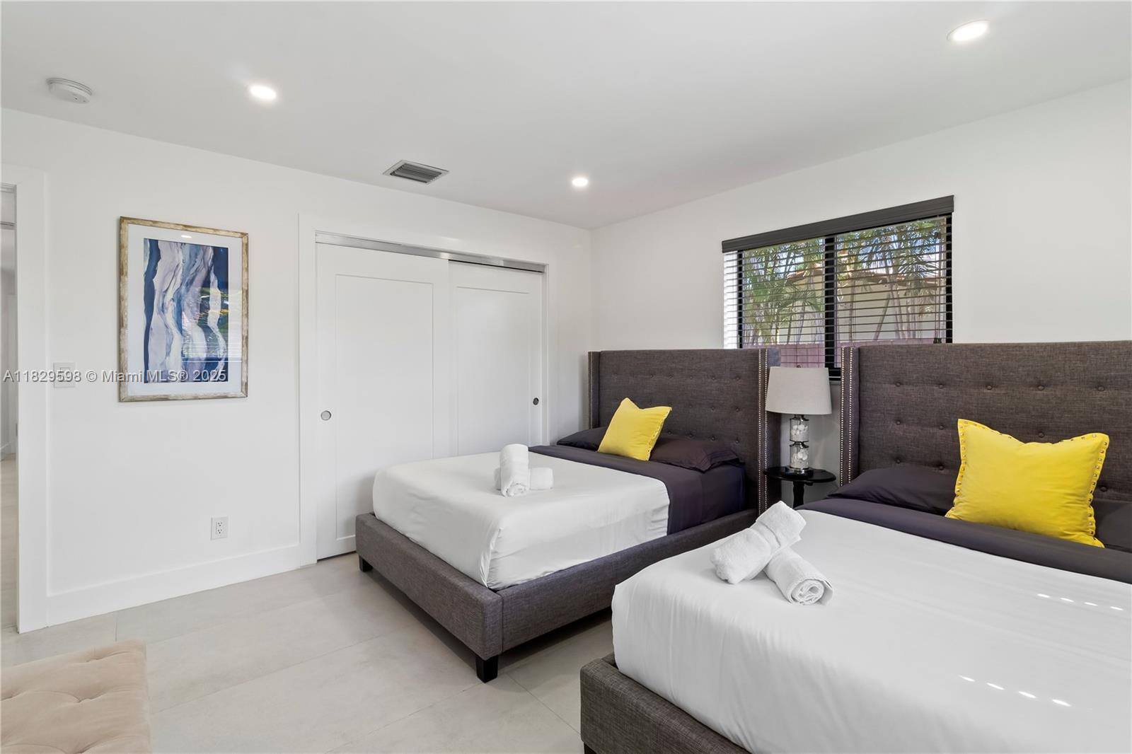 5131 Monroe Street Hollywood, FL 33021 - Photo 27 of 52 a bedroom with a bed and couch