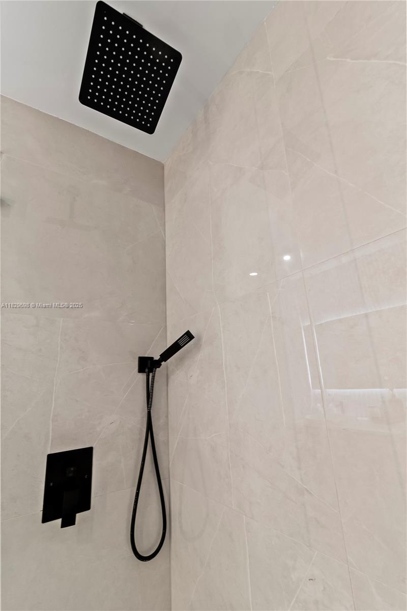 5131 Monroe Street Hollywood, FL 33021 - Photo 32 of 52 a bathroom with a shower