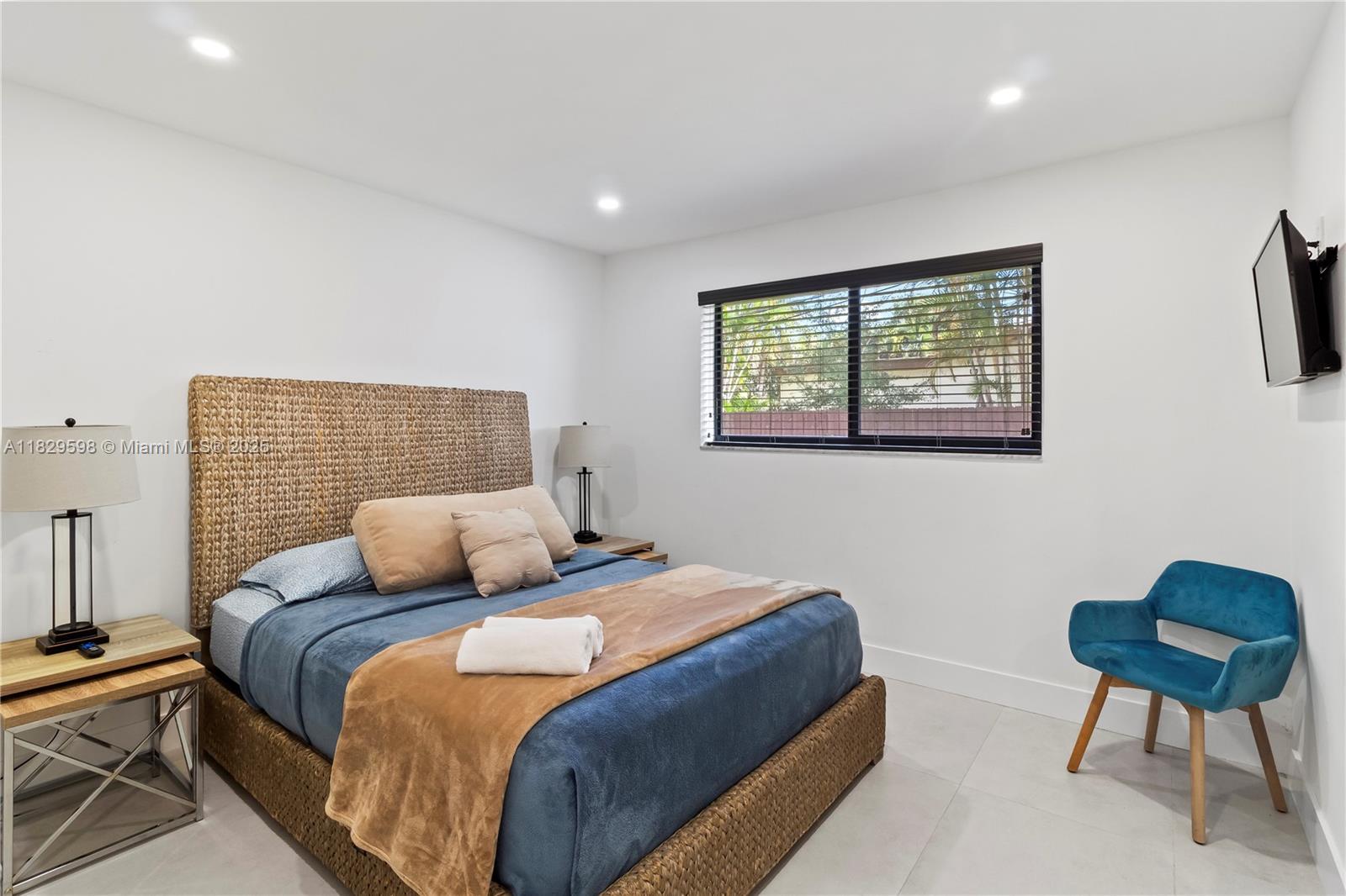 5131 Monroe Street Hollywood, FL 33021 - Photo 37 of 52 a bedroom with a bed a chair and a couch