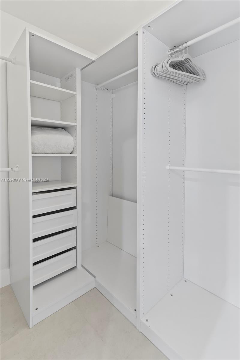 5131 Monroe Street Hollywood, FL 33021 - Photo 38 of 52 a view of walk in closet with empty racks