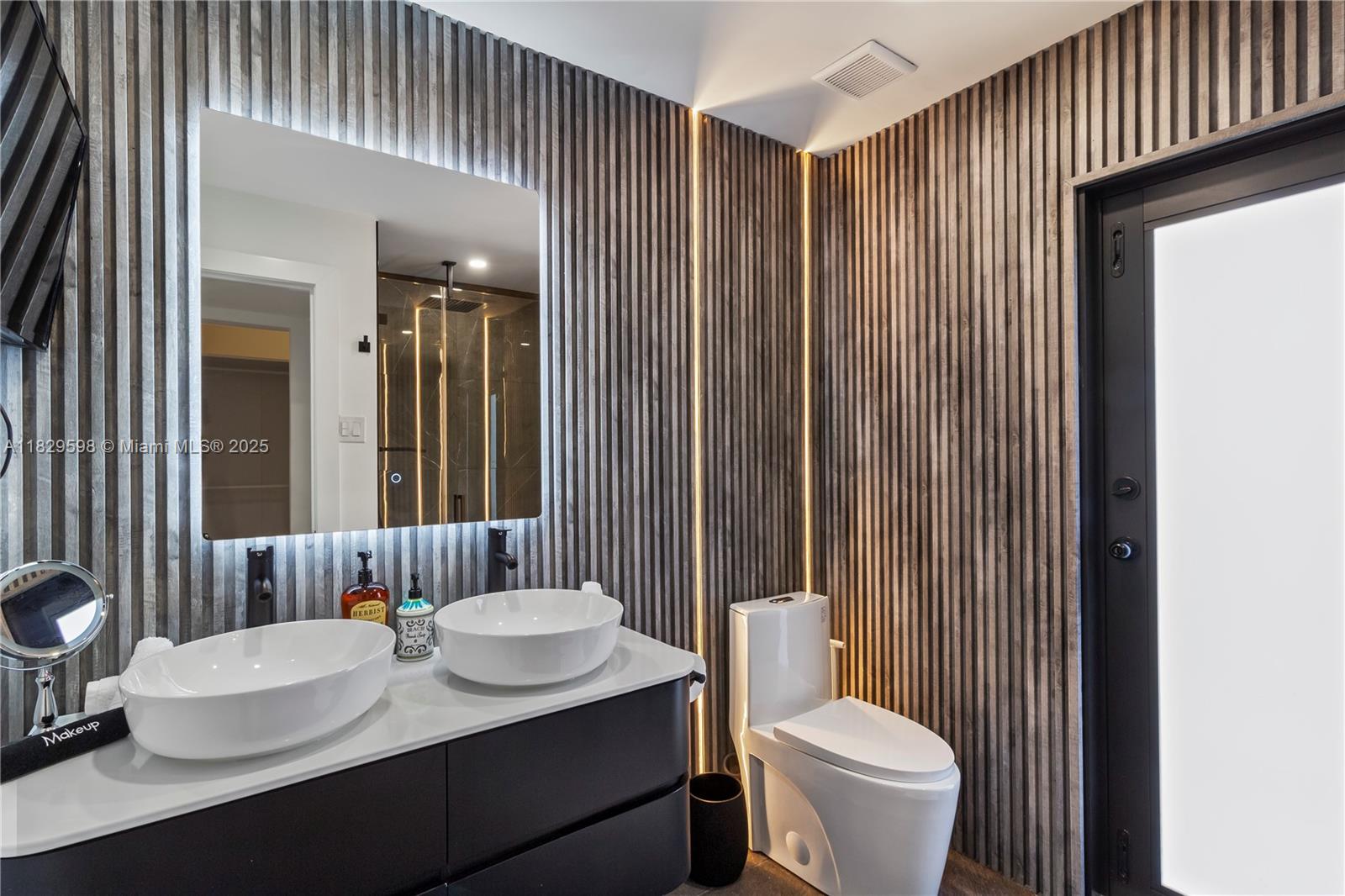 5131 Monroe Street Hollywood, FL 33021 - Photo 39 of 52 a bathroom with a sink a toilet and shower