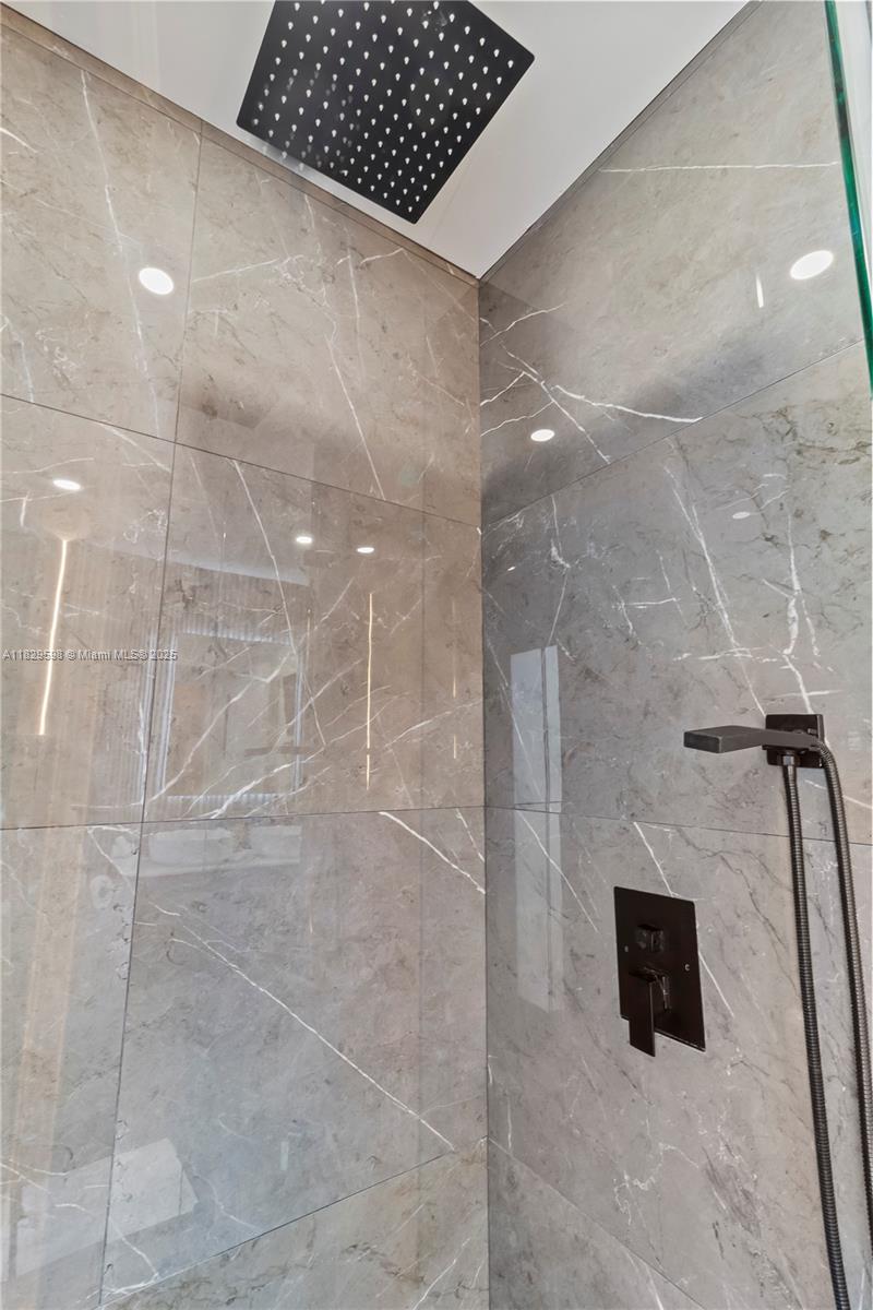 5131 Monroe Street Hollywood, FL 33021 - Photo 41 of 52 a bathroom with a shower