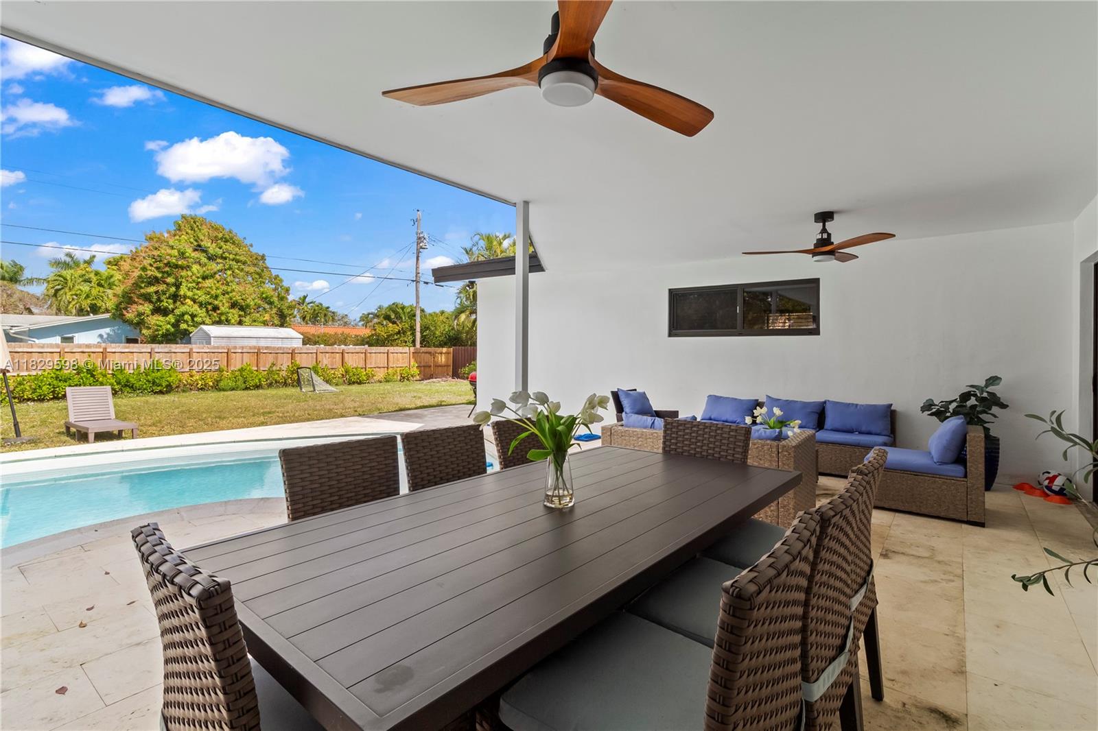 5131 Monroe Street Hollywood, FL 33021 - Photo 43 of 52 a view of a dining room with furniture and wooden floor