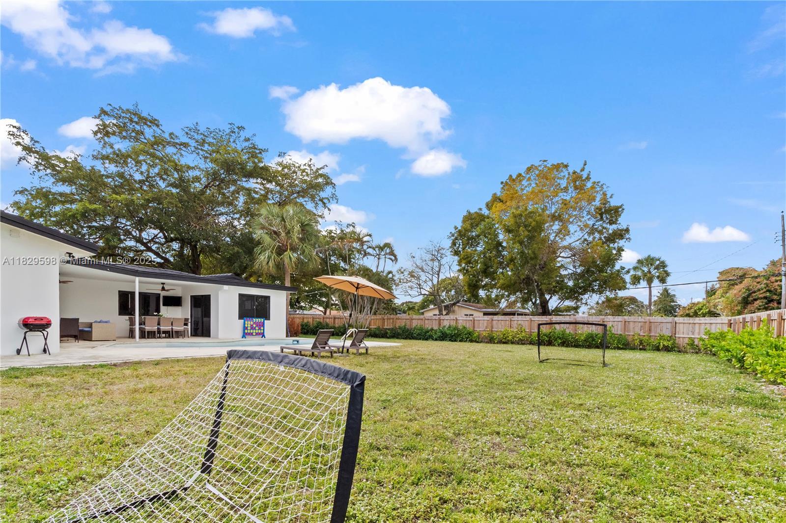 5131 Monroe Street Hollywood, FL 33021 - Photo 50 of 52 a view of a house with a yard