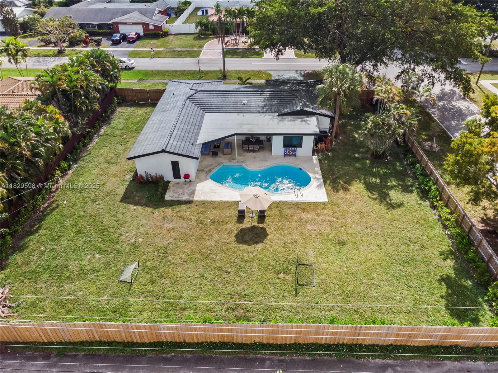 5131 Monroe Street Hollywood, FL 33021 - Photo 7 of 52 an aerial view of a house with yard swimming pool and outdoor seating