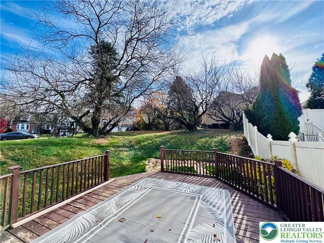 a view of a deck with a yard