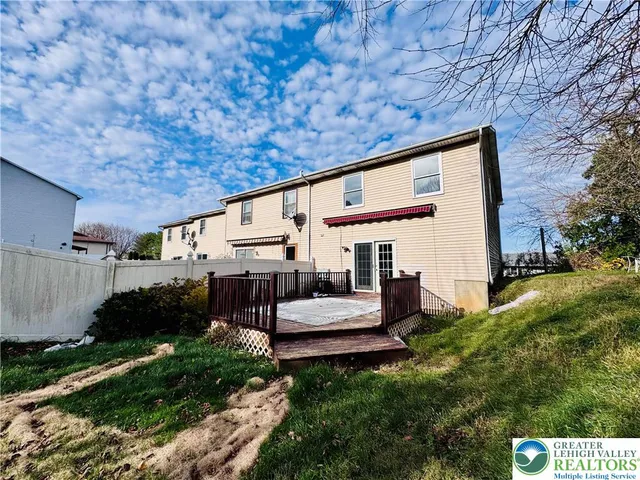 a view of a house with a back yard