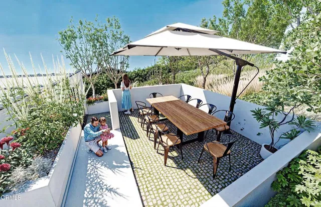 a large kitchen with a table and chairs in it