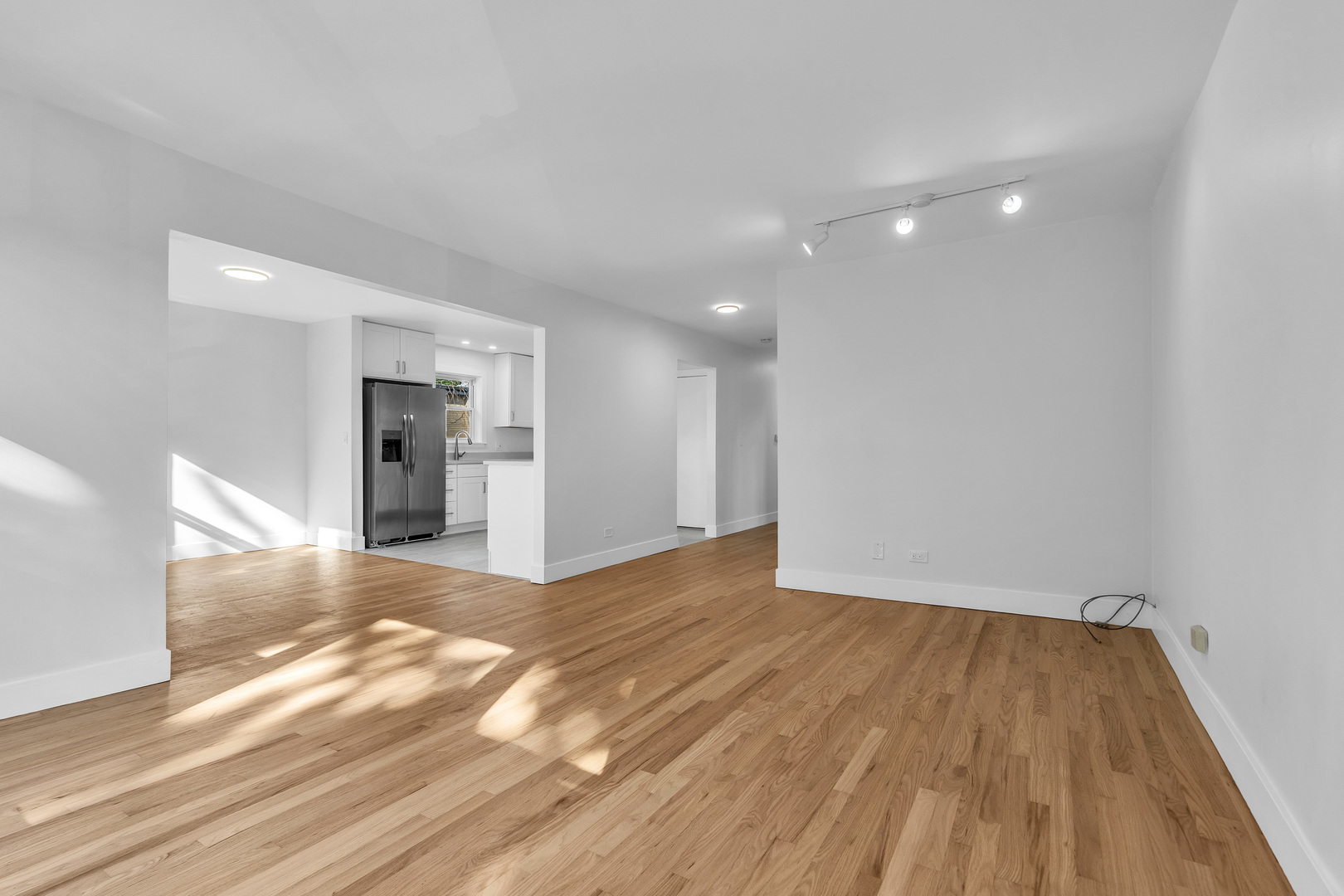 512 Ida Court, Unit 2 Mount Prospect, IL 60056 - Photo 15 of 16 a view of empty room with wooden floor