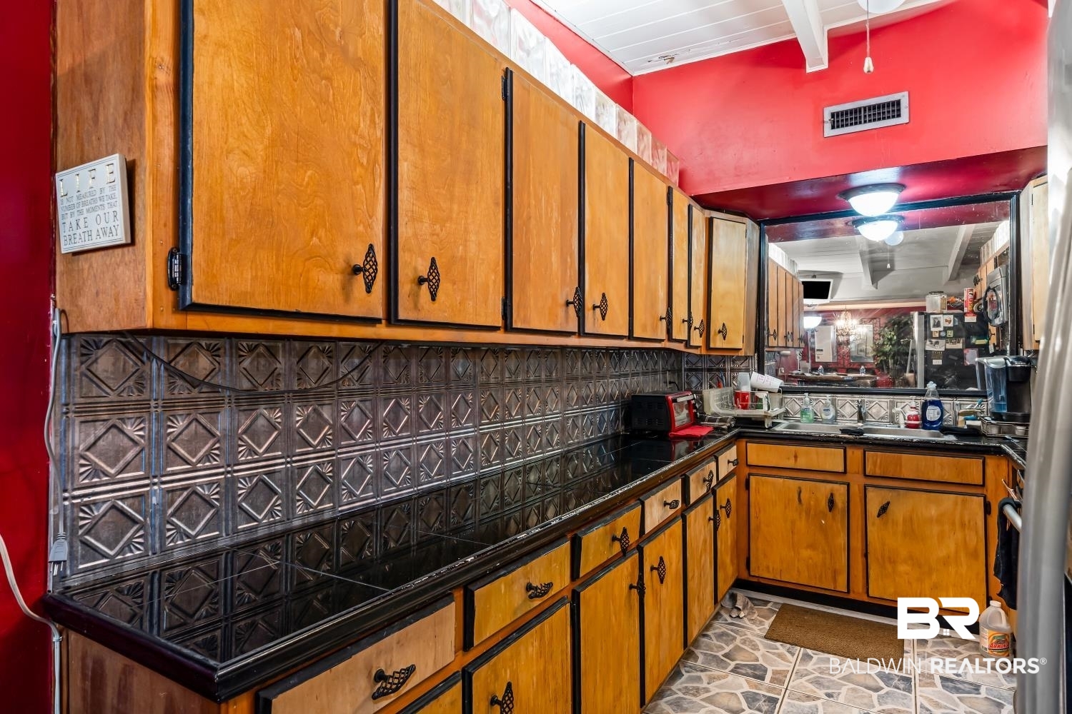 1091 Azalea Road Mobile, AL 36693 - Photo 4 of 19 Kitchen with decorative backsplash and sink