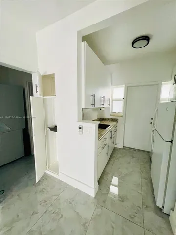 a kitchen with a stove and a microwave