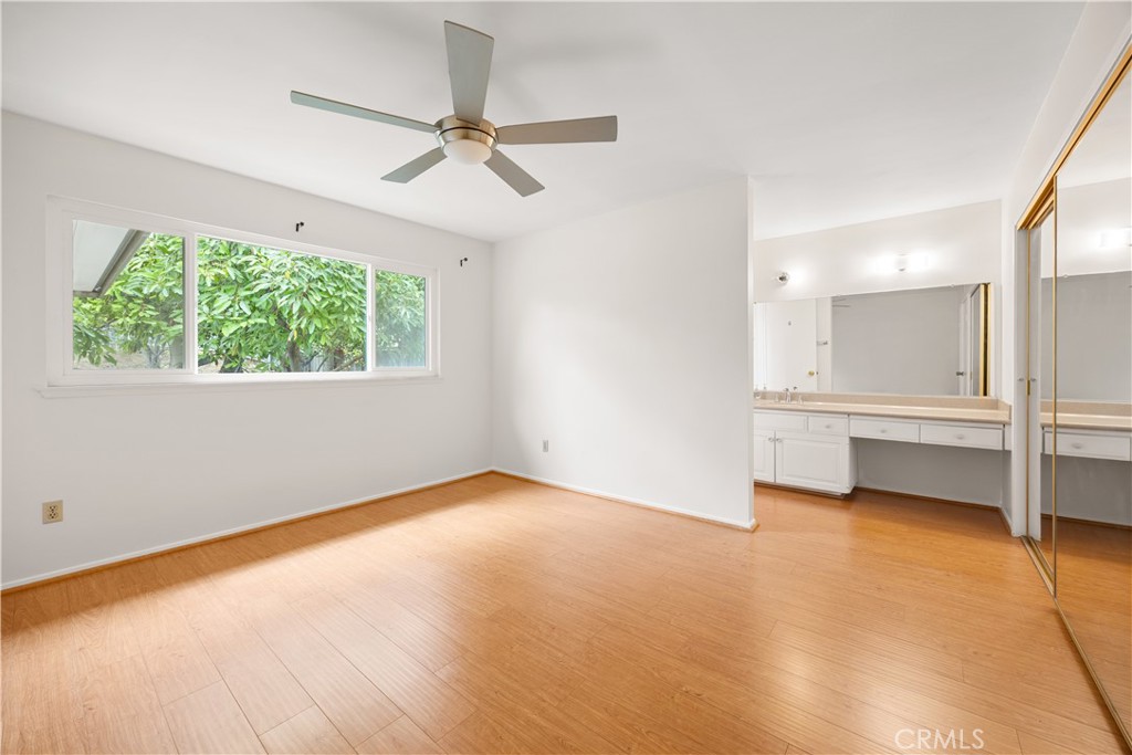 3430 Bahia Place Riverside, CA 92507 - Photo 21 of 34 an empty room with windows and fan