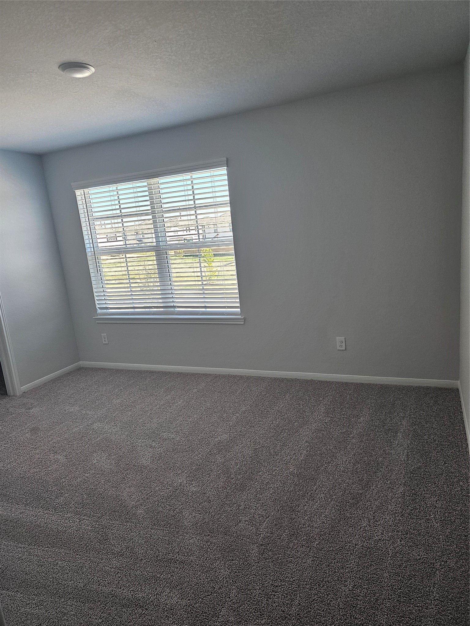 5207 Shallowhurst Lane Katy, TX 77449 - Photo 26 of 27 an empty room with a window