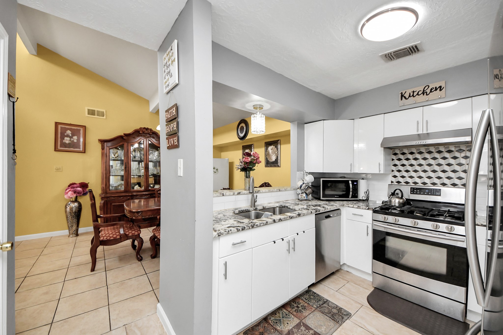 4155 Amir Street Houston, TX 77072 - Photo 19 of 43 a kitchen with a sink appliances and cabinets