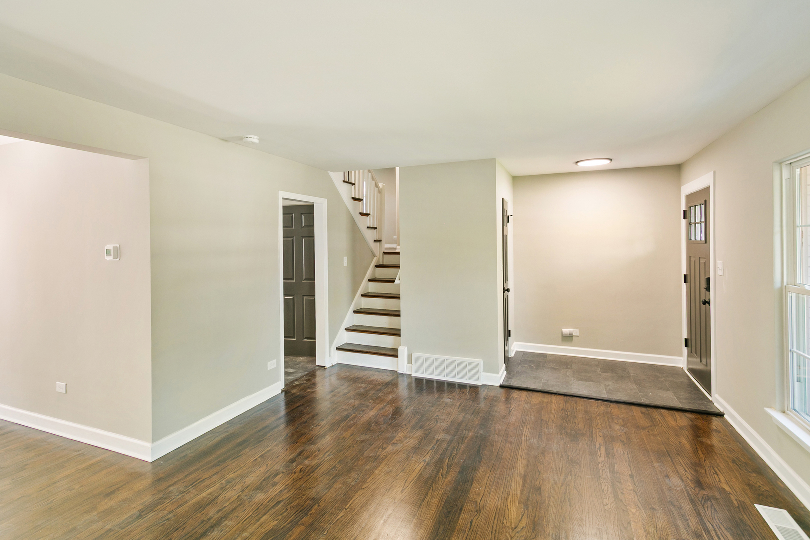 531 Winchester Road Chicago Heights, IL 60411 - Photo 5 of 28 an empty room with wooden floor and entryway