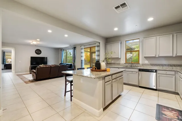 a living room with furniture or couch and a potted plant