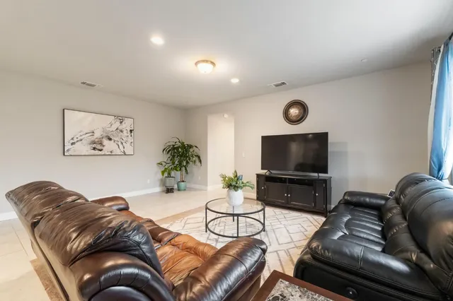 a bedroom with a bed and a chair