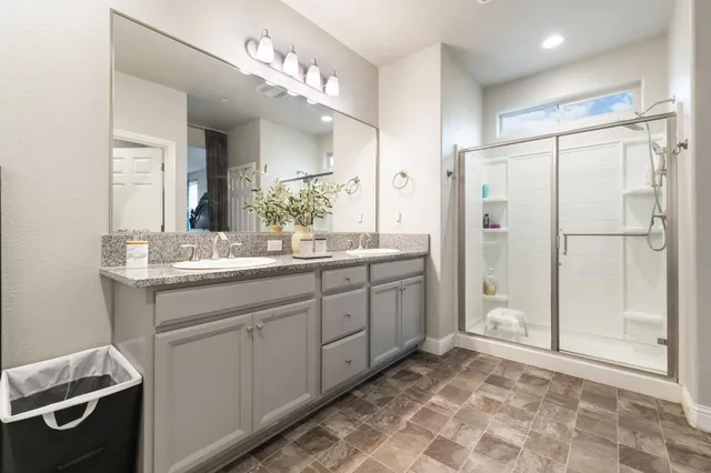 a living room with furniture and a gym machine