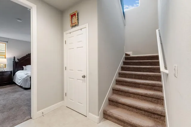 a bed room with a bed and a window