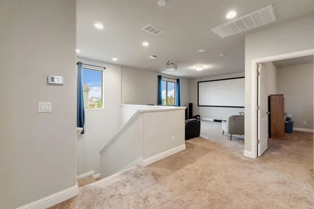 a bedroom with a bed and a chair