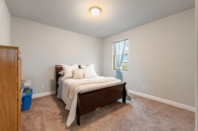 a swimming pool covered with buildings in the background