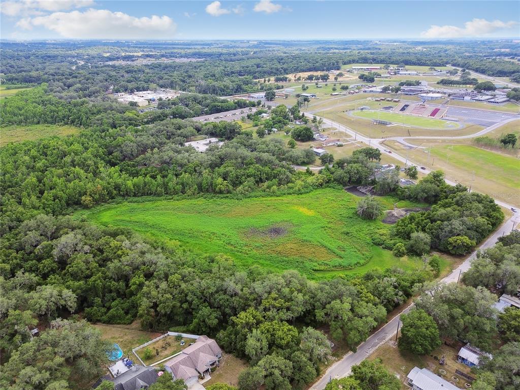 Dixie Avenue Dade City, FL 33525 - Photo 4 of 8 an aerial view of residential houses with outdoor space and trees