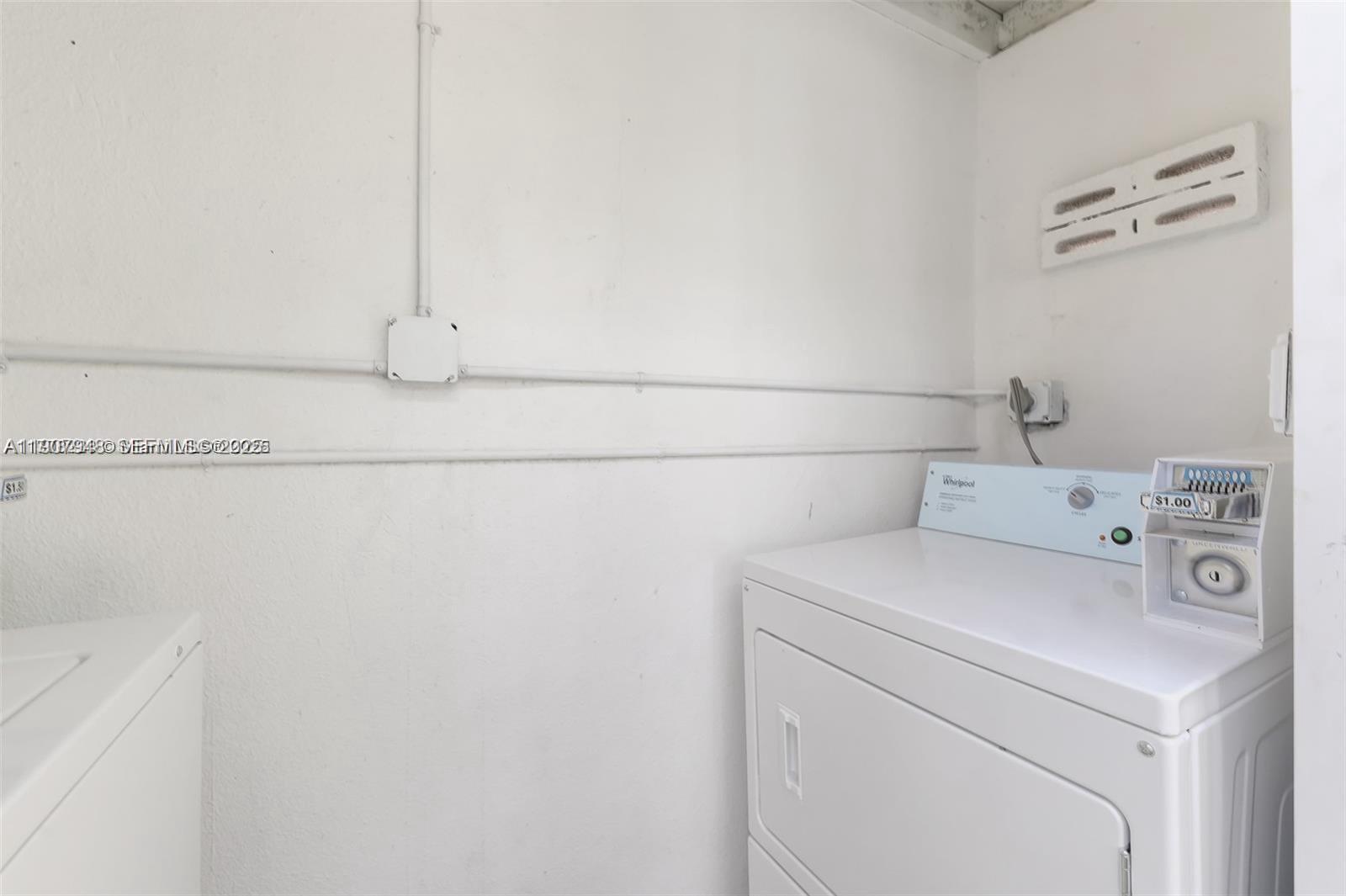 421 75th Street, Unit 3 Miami Beach, FL 33141 - Photo 12 of 21 a utility room with dryer and washer