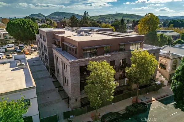an aerial view of a house with a garden