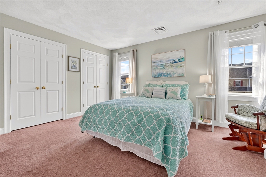 102 Central Street, Unit 5A Saugus, MA 01906 - Photo 16 of 31 a bedroom with a bed and a painting