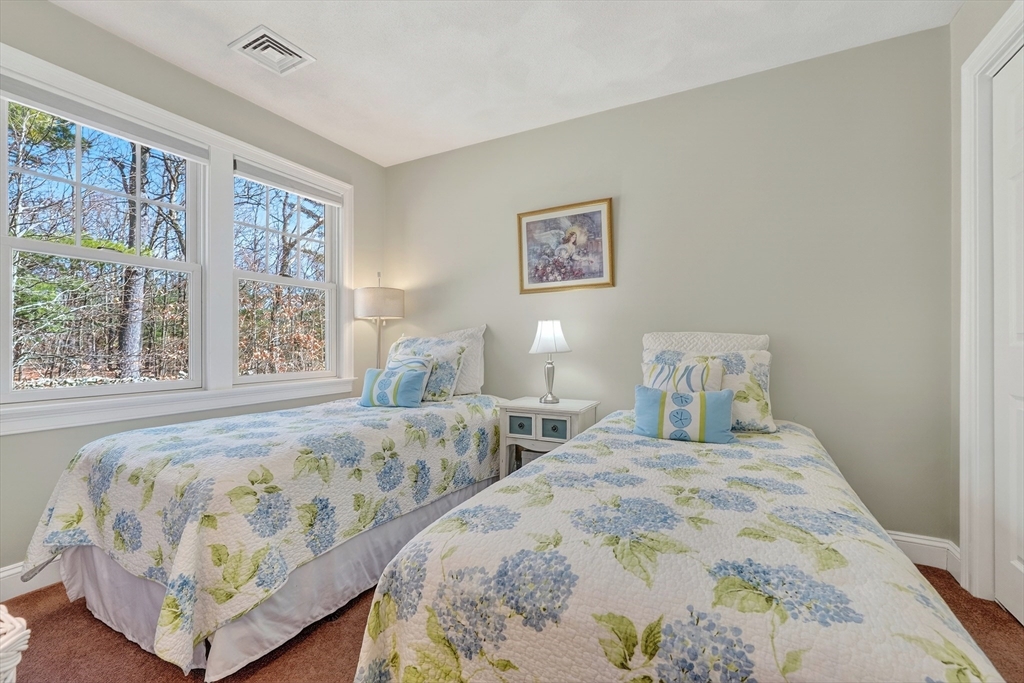 102 Central Street, Unit 5A Saugus, MA 01906 - Photo 20 of 31 a bedroom with two beds and a large window