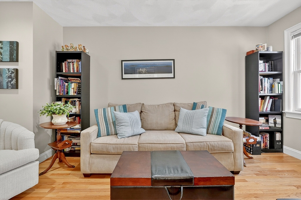 102 Central Street, Unit 5A Saugus, MA 01906 - Photo 22 of 31 a living room with furniture and book shelf