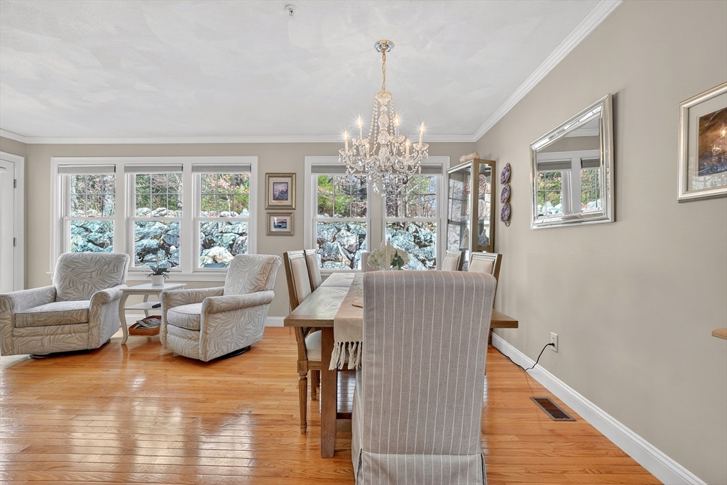 102 Central Street, Unit 5A Saugus, MA 01906 - Photo 6 of 31 a living room with furniture and a chandelier