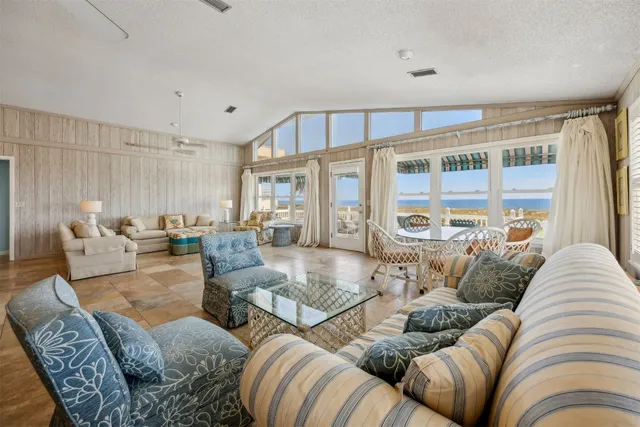 a room with lots of furniture and a large window