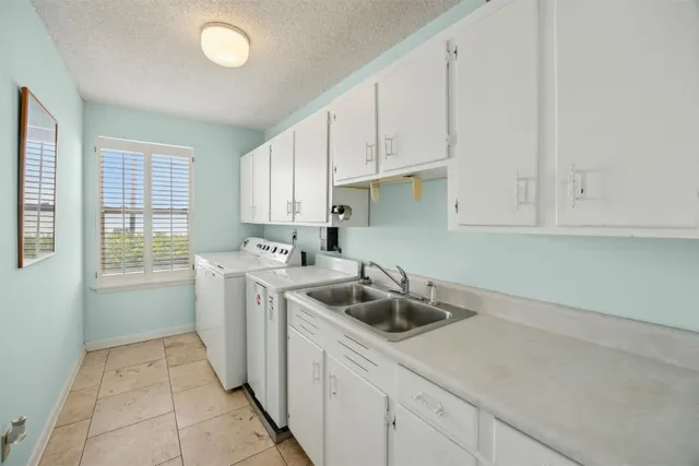 a view of a lake with houses in the back