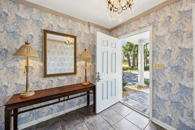 a dining hall with stainless steel appliances granite countertop a table and chairs