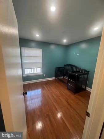 a view of an empty room with windows